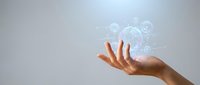 Hand holding holographic digital network connections with glowing data visualization and futuristic technology interface for business presentations.