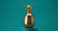 Golden metallic pineapple sculpture on turquoise background. Modern minimalist design element for luxury branding, home decor and contemporary art projects.