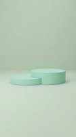 Two mint green cylindrical podiums on a soft sage background, minimal product display scene for cosmetics, beauty or retail showcase.