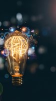 Glowing light bulb with brain filament surrounded by digital technology icons and data visualization elements on dark background for innovation concepts.