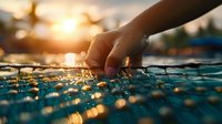 Hand touching rippling water surface at sunset with golden sunlight creating magical bokeh reflections and sparkles, peaceful serene moment captured in swimming pool.