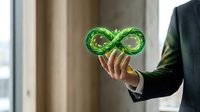 Businessman in dark suit holding glowing green infinity symbol representing sustainable business, circular economy, and environmental responsibility for corporate sustainability concepts.