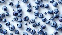 Fresh ripe blueberries scattered on white background, top view. Natural organic berries pattern showing texture and details in blue tones.