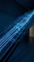 Glowing blue fiber optic cables bundled together with illuminated light trails, representing high-speed data transmission, network connectivity, and telecommunications technology infrastructure.