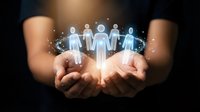 Hands holding glowing human figures representing teamwork, community support, and social connection in business networking and collaboration concept.