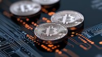 Silver cryptocurrency coins on circuit board with glowing orange elements, representing digital money and blockchain technology in modern finance.