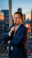 Thoughtful middle-aged Caucasian businessman in navy suit holding pen by office window with city skyline at dusk for corporate leadership concepts.