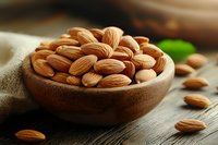 Raw almonds in wooden bowl on rustic table, scattered nuts on dark wood surface with soft natural lighting and blurred background, macro food photography.