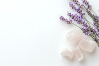 Calming spa composition with rose quartz crystals and fresh lavender sprigs on white background, minimal wellness and meditation concept for relaxation.