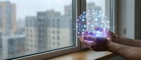 Hands cupping glowing digital network connections by rainy window with city view. Technology innovation and connectivity concept for business presentations.