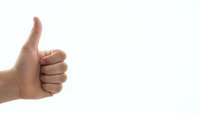 Hand showing thumbs up gesture on white background for positive feedback and approval concepts.