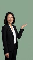 Professional Asian businesswoman in black suit presenting with open palm gesture on sage green background for corporate marketing materials.