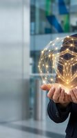 Businessman holding glowing digital network sphere with connected nodes representing global connectivity and technology innovation in modern office.