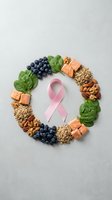 Pink ribbon surrounded by healthy foods including salmon, blueberries, spinach, nuts and quinoa representing cancer prevention nutrition and wellness support.