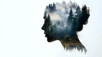 Female profile silhouette with double exposure effect showing misty forest landscape, evergreen trees and fog creating dreamy nature meditation concept.