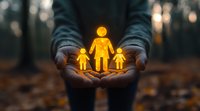 Glowing yellow family figures held in cupped hands against dark forest background, symbolizing protection, care and family unity in nature setting at dusk.