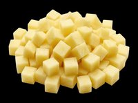 Diced raw potato cubes pile isolated on transparent background, ready for food design, clipart, stickers, print on demand, and sublimation projects.