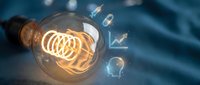 Glowing incandescent bulb with floating digital icons representing innovation, creativity, and business growth on blue background for web design and marketing.