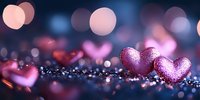 Pink glittery hearts on dark background with bokeh lights and sparkles, romantic Valentine's Day composition with soft dreamy blur effect and copy space.