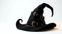 Black witch hat with brass buckles and chains isolated on white background for Halloween costume design and magical themed projects.