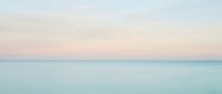 Serene seascape with calm turquoise waters meeting soft pastel sky at horizon, conveying tranquility and peace for wellness, travel, and meditation design projects.