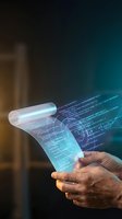 Hands holding futuristic holographic display with programming code and data visualization emerging from digital scroll in cyberpunk style lighting.