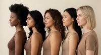 Five diverse women in profile wearing nude-toned tops showcasing multicultural beauty and inclusivity for skincare, cosmetics and fashion campaigns.