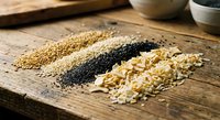Assorted organic grains and seeds arranged on rustic wooden cutting board including quinoa, oats, chia seeds for healthy cooking and nutrition.