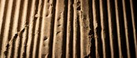 Footprints in sand with parallel ridged patterns creating textured surface for travel and adventure concepts.