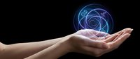 Hands holding glowing blue holographic sphere with spiral energy patterns on black background for technology and innovation concepts.