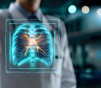 Glowing digital x-ray visualization of human ribcage and spine with highlighted area in orange against medical professional background in modern hospital setting.