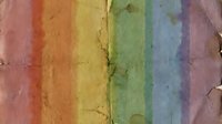 Colorful rainbow chalk pastel stripes on textured paper surface with natural cracks and weathered edges for artistic design projects.