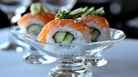 Fresh salmon and cucumber sushi rolls served in elegant glass bowl with crushed ice, showcasing vibrant colors and precise culinary presentation for restaurant menu.
