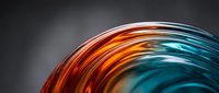 Vibrant curved light trails in orange and teal blend together creating dynamic motion effect against neutral background for design projects.