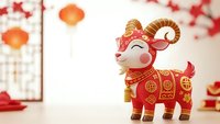 Red and gold decorative goat figurine with traditional Asian ornaments and patterns for Chinese New Year celebration and festive holiday decoration.