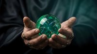 Hands holding glowing green crystal ball with mystical energy light effects for fortune telling divination and spiritual guidance concepts.
