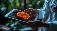 Medical professional in white coat holding digital tablet displaying glowing orange brain scan visualization against dark background with neural network pattern.