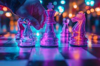 Glass chess pieces on board illuminated by vibrant neon pink and blue lights creating dramatic atmosphere with bokeh effect in background. Strategic game concept.
