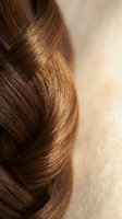 Luxurious brown hair braid with glossy texture and natural highlights showcasing healthy hair care and styling for beauty salon treatments.
