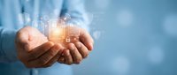 Businessman hands holding glowing digital technology icons and network connections for modern business solutions and innovation concepts.