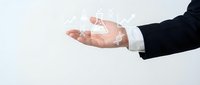 Businessman hand holding digital house icon with network connections, representing real estate technology and smart home solutions for property management.