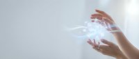 Two hands holding glowing digital light waves and data streams, representing technology, innovation, and digital transformation for business and communication concepts.