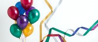 Colorful party balloons with festive ribbons on white background perfect for celebrations, birthdays, anniversaries and special events decoration.