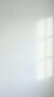 Minimalist white wall with soft natural light casting geometric window shadows, creating clean abstract background for design projects and modern interior concepts.