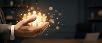 Businessman holding glowing light bulbs in cupped hands, symbolizing innovation, ideas, and creative business solutions for corporate growth.