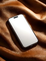 Modern smartphone with blank white screen on textured brown leather background, creating luxurious product mockup for digital design presentation.