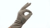 Isolated hand wearing gray glove making okay sign gesture against white background, suitable for design projects, presentations, and commercial applications.