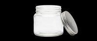 Small clear glass jar with metal lid isolated on transparent background, ready for stickers, clipart, print on demand, and t-shirt design use.