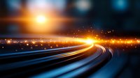 Glowing light trails curve along dark highway with bright orange sunburst and sparkles against blurred blue background, creating dynamic motion effect.