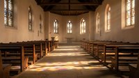 Empty church interior with wooden pews and stained glass windows creating warm sunlight patterns on stone floor for worship and spiritual concepts.